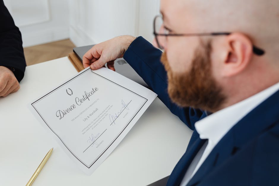 A man holding a divorce certificate in a formal office environment.