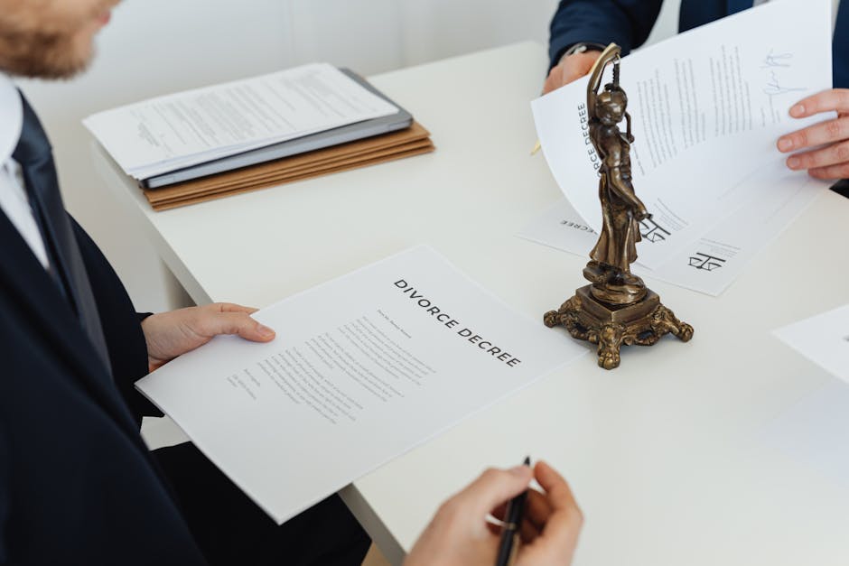 Two professionals discuss divorce decree documents, focusing on legal negotiations.
